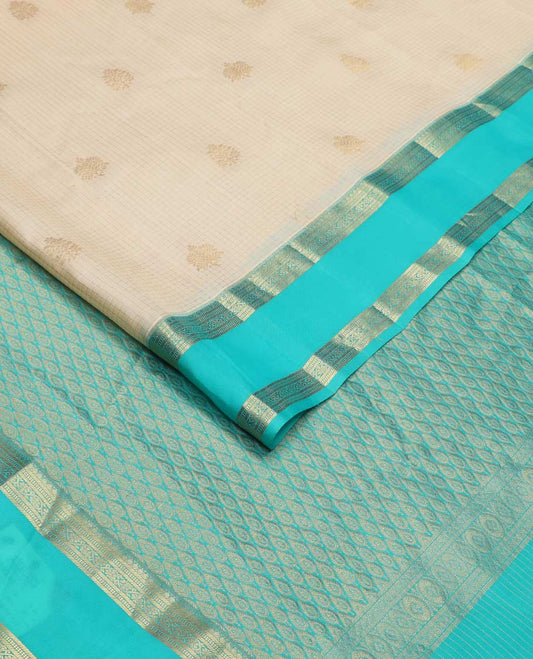 Cream zari checked and buttas Vasundhara silk mix saree, contrast rettai pettu border of thilakam, banaras, and kodi visiry designs, and pallu of peacock motifs