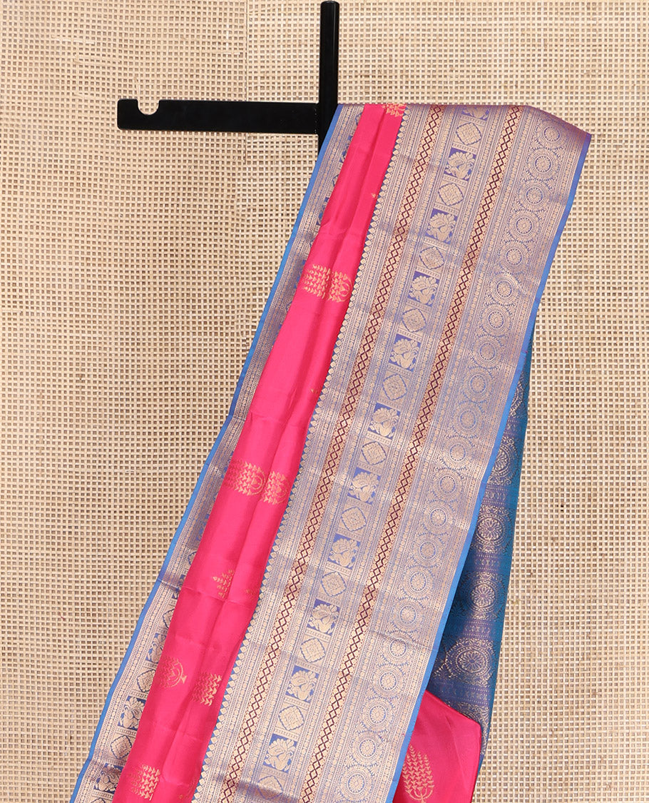 Pink Vasundhara Lite Silk Mix Saree, Beautified with Deepam Buttas, Complemented by a Contrast Border of Thilakam Mokku, Poun, Muthu, Diamond and Chakram Designs, Pallu Steeped with Chakram Designs, and Paired with a Contrast Blouse