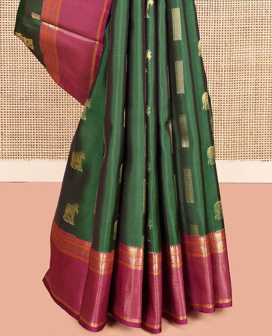Green Vasundhara Lite Silk Mix Saree, Adorned with Pichwai Cow Buttas, Complemented by a Contrast Border of Rekku, Neli, and Yaanai Designs, Intricate Pallu, and a Contrast Blouse