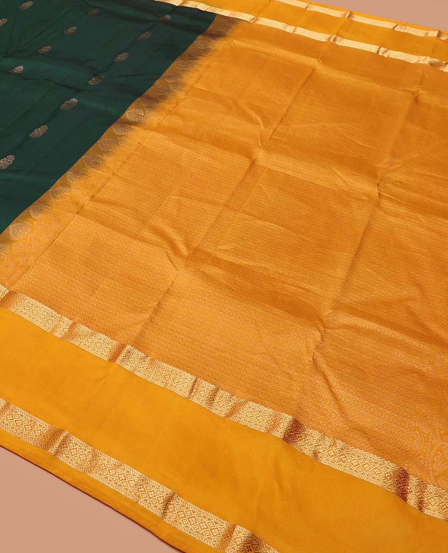 Green zari buttas silk saree, contrast rettai pettu border of rekku, muthu, and diamond designs, and jaal pallu