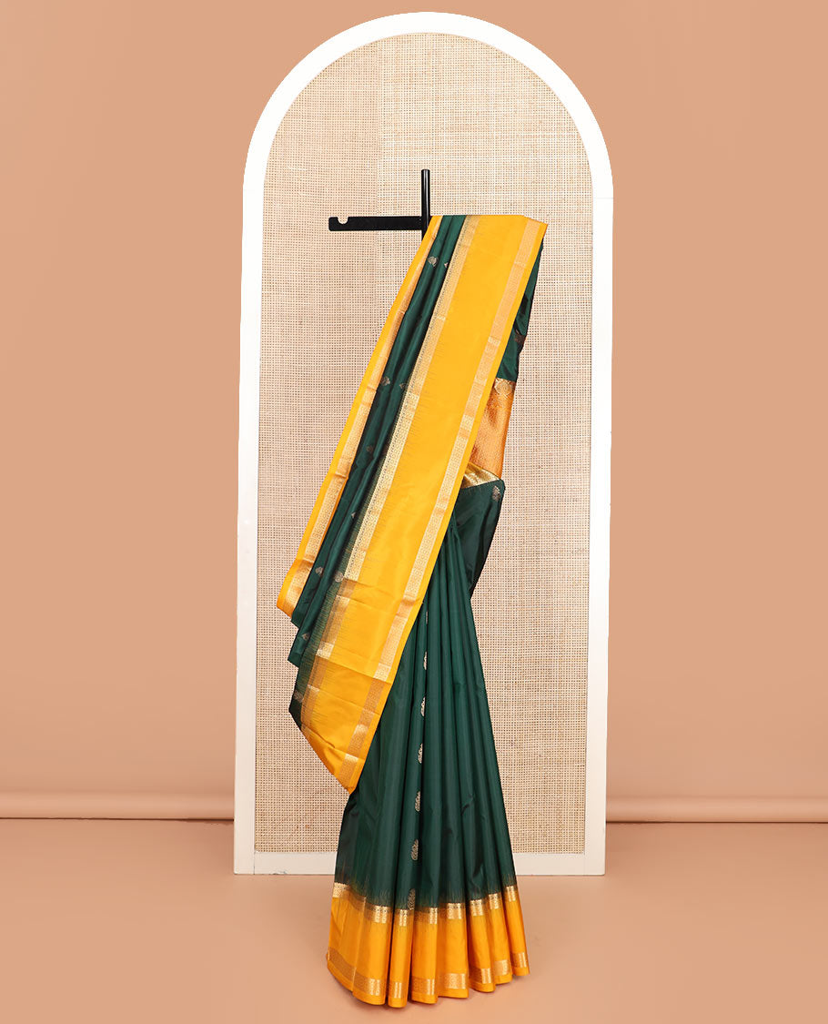 Green zari buttas silk saree, contrast rettai pettu border of rekku, muthu, and diamond designs, and jaal pallu