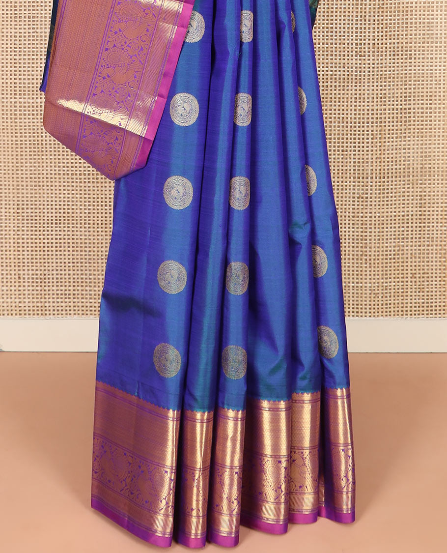 Blue Vasundhara Silk Saree Richly Detailed with Round Mayil Buttas, Highlighted with a Contrast Border of Muthu, Mayil Kann, and Mayil Designs, Grandly Zari Woven Pallu of Jaal Design, and Paired with a Contrast Blouse