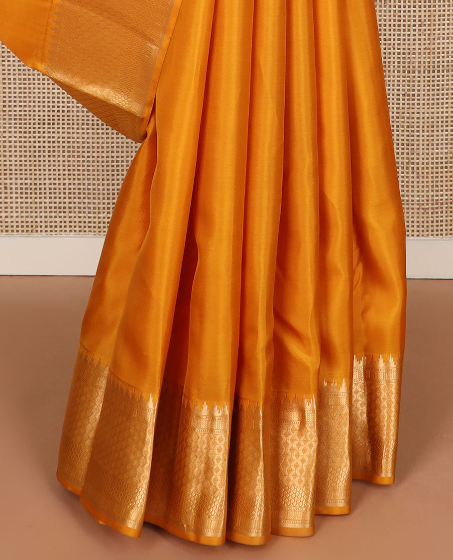 Mango yellow plain silk saree, zari border of thazampoo rekku & geometric patterns & vanki pallu