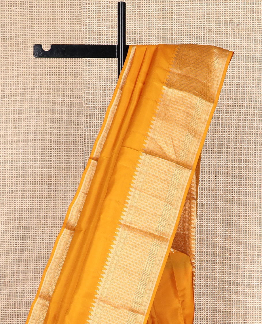 Mango yellow plain silk saree, zari border of thazampoo rekku & geometric patterns & vanki pallu