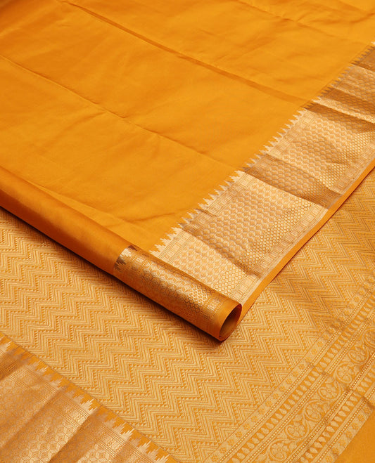 Mango yellow plain silk saree, zari border of thazampoo rekku & geometric patterns & vanki pallu