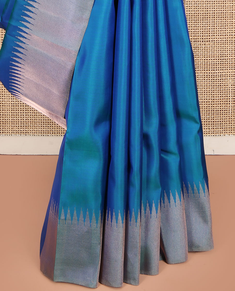Blue Plain Vasundhara Silk Saree, Highlighted by Thazampoo Rekku Zari Border, Pallu of Mayil Kann, and Yaali Designs, and Paired with a Matching Blouse
