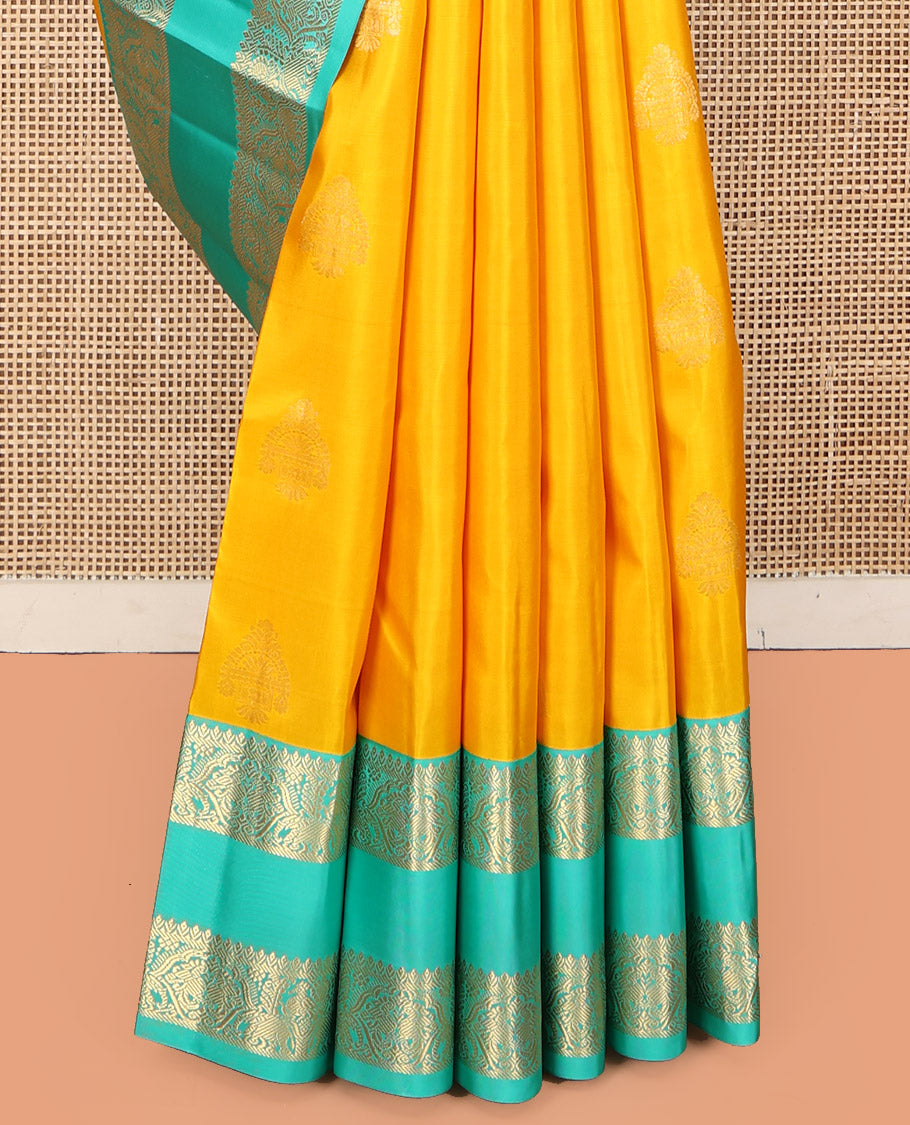 Yellow Vasundhara Silk Saree, Woven with Zari Buttas, Complemented by a Contrast Rettai Pettu Mayil-Yaanai Border, Jaal Pallu, and a Contrast Blouse