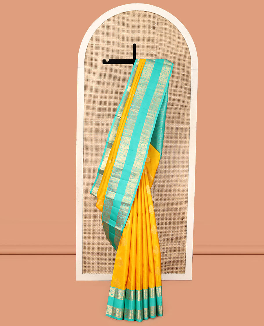 Yellow Vasundhara Silk Saree, Woven with Zari Buttas, Complemented by a Contrast Rettai Pettu Mayil-Yaanai Border, Jaal Pallu, and a Contrast Blouse