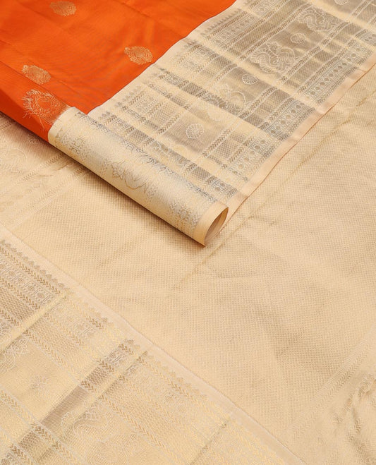 Orange zari buttas silk saree, contrast mayil kann pallu & border of thilakam,kathir,rudraksham,mayil kann & annam chakram
