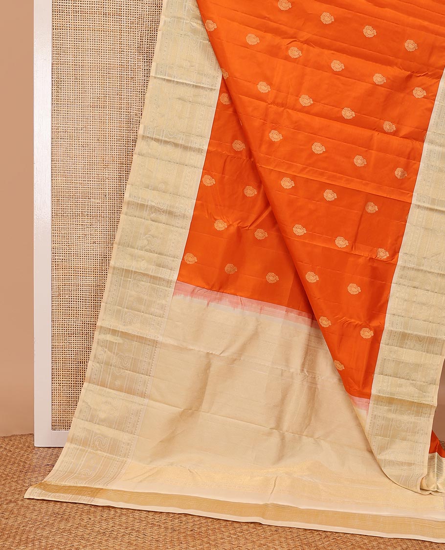 Orange zari buttas silk saree, contrast mayil kann pallu & border of thilakam,kathir,rudraksham,mayil kann & annam chakram