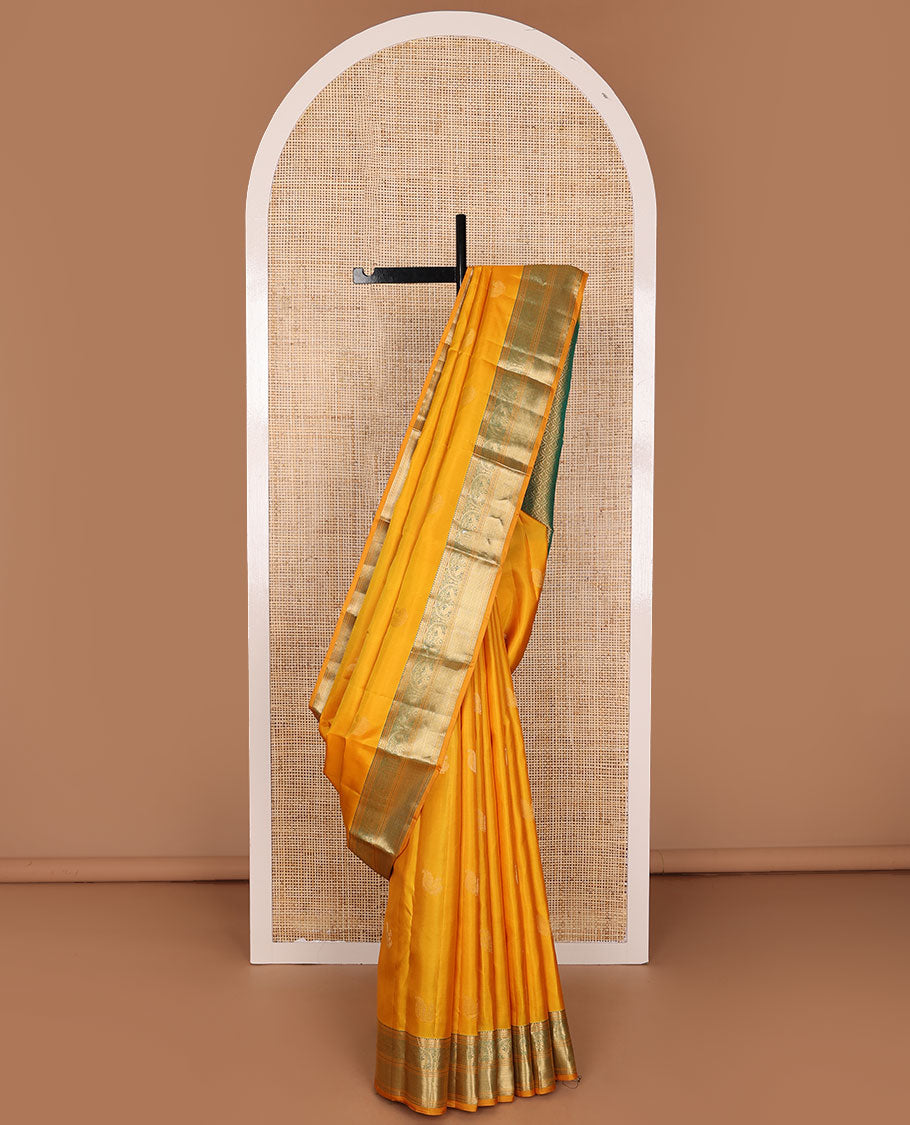 Yellow zari buttas silksaree, contrast scallop design pallu & border of rekku,banaras,mayil kann, chakram & mayil designs