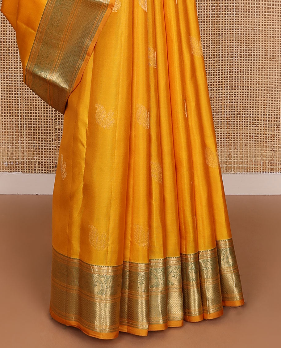 Yellow zari buttas silksaree, contrast scallop design pallu & border of rekku,banaras,mayil kann, chakram & mayil designs
