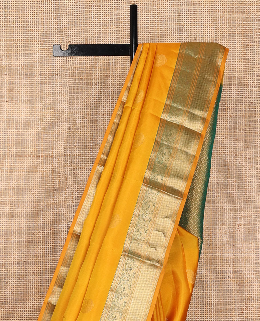 Yellow zari buttas silksaree, contrast scallop design pallu & border of rekku,banaras,mayil kann, chakram & mayil designs