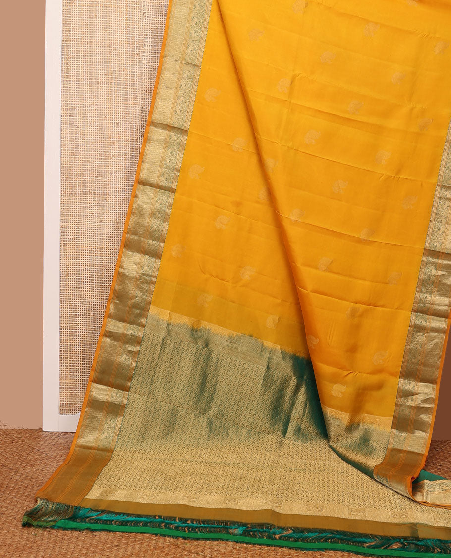 Yellow zari buttas silksaree, contrast scallop design pallu & border of rekku,banaras,mayil kann, chakram & mayil designs