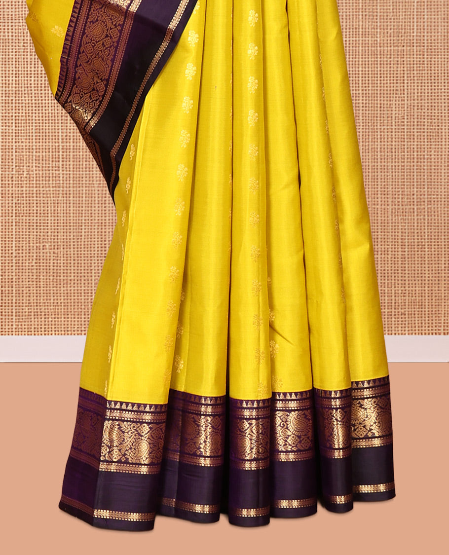 Yellow Vasundhara Silk Saree, Sparsely Woven with Zari Buttas, Contrast Rettai Pettu Border of Rekku, Muthu, Kathir, and Kodi Manga Designs, Intricate Pallu, and Contrast Blouse