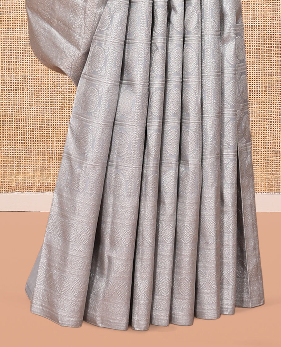 Grey Kanchipuram Wedding Silk Saree Features Chakram Jacquard Design, a Sparsely Woven Zari Border, Ogee Pallu, and a Matching Blouse