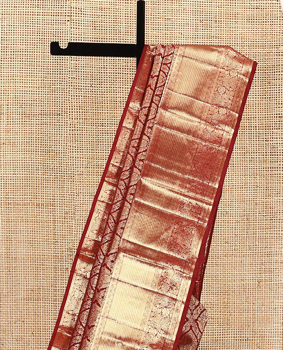 Light maroon jacquard kanchipuram silk saree, zari border of thilakam, muthu, and kodi visiry designs, and jaal pallu