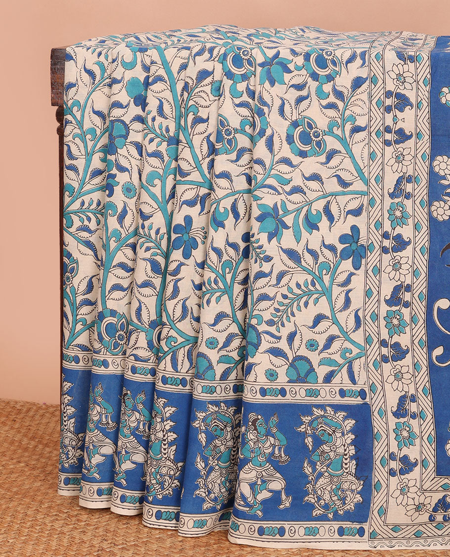Sandal-base blue floral vine machine-printed kalamkari cotton saree, contrast human motifs printed border & pallu of Pichwai cow & Radha Krishna print