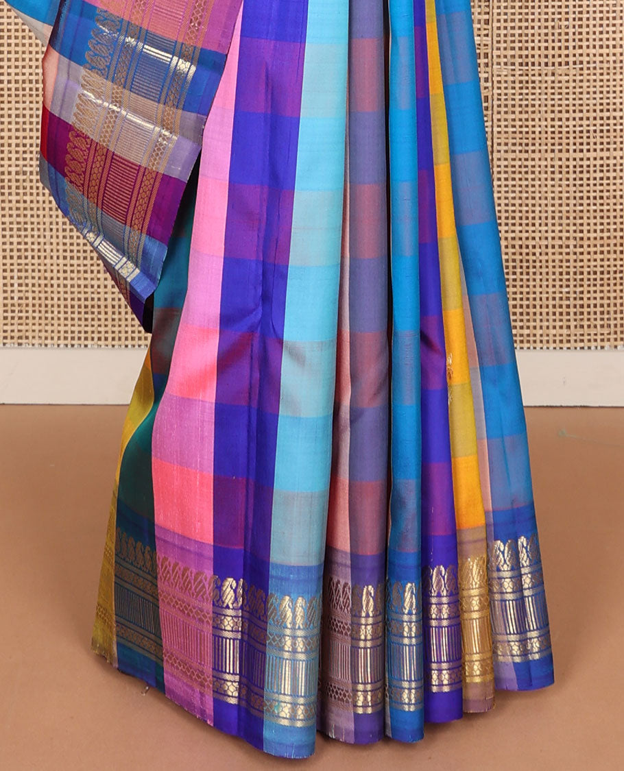 Multi-color paalum pazhamum style checked and zari buttas Kanchipuram silk saree, one-sided border of manga mokku, and then kuli kann designs, and contrast zari woven pallu