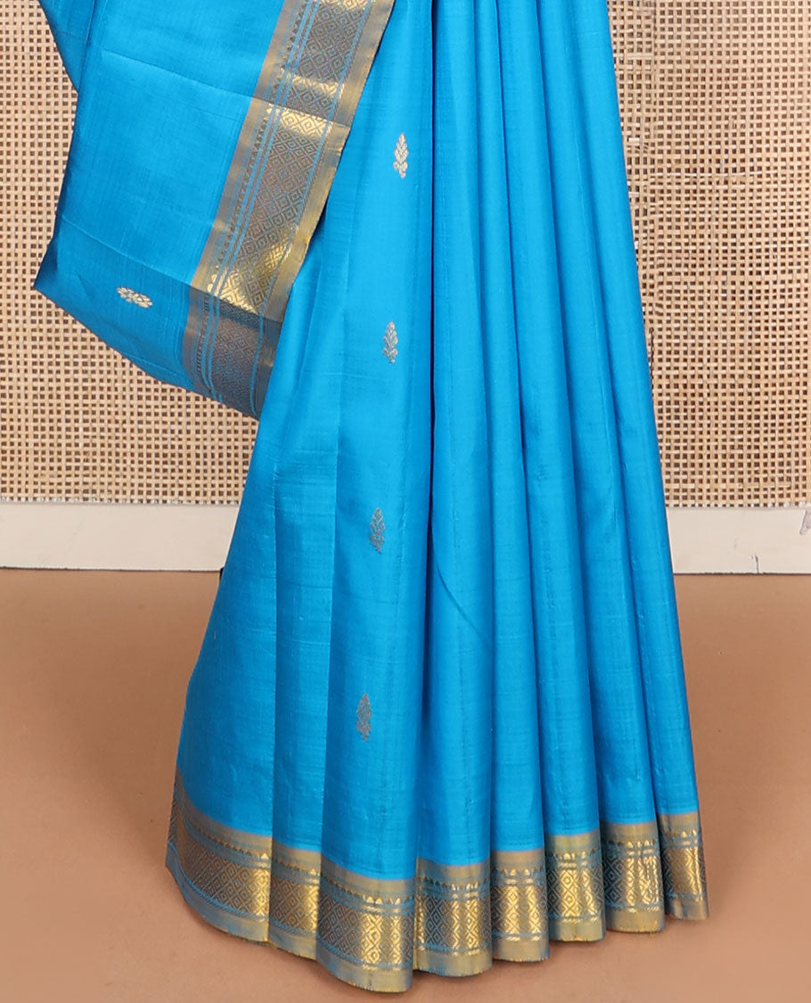 Blue kanchipuram silksaree with zari buttas, contrast one-sided border of rekku & mayil kann & zari design pallu