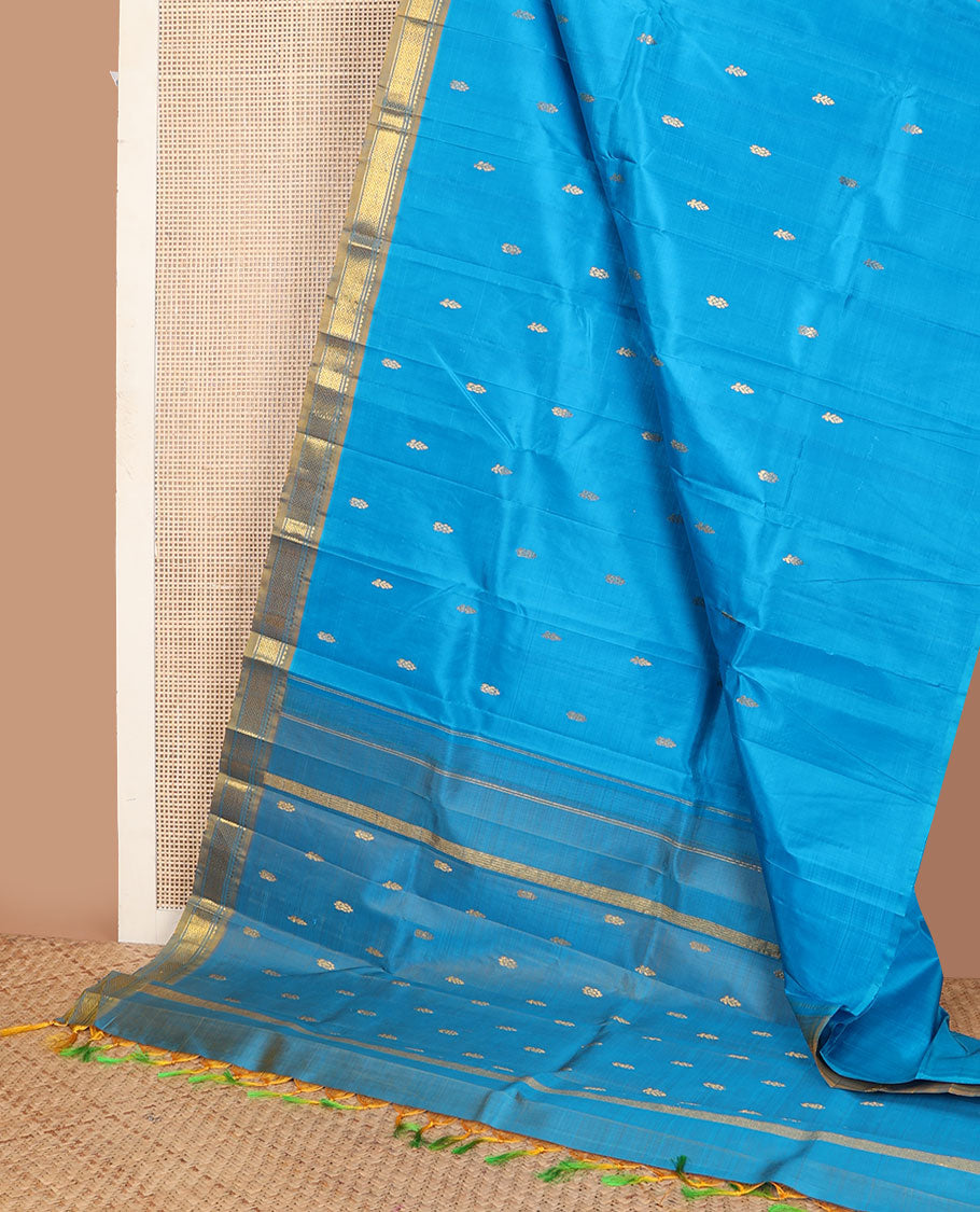 Blue kanchipuram silksaree with zari buttas, contrast one-sided border of rekku & mayil kann & zari design pallu