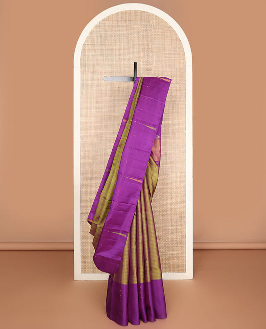 Green striped Kanchipuram silksaree, contrast border of thazampoo rekku & buttas & pallu of seppu rekku designs