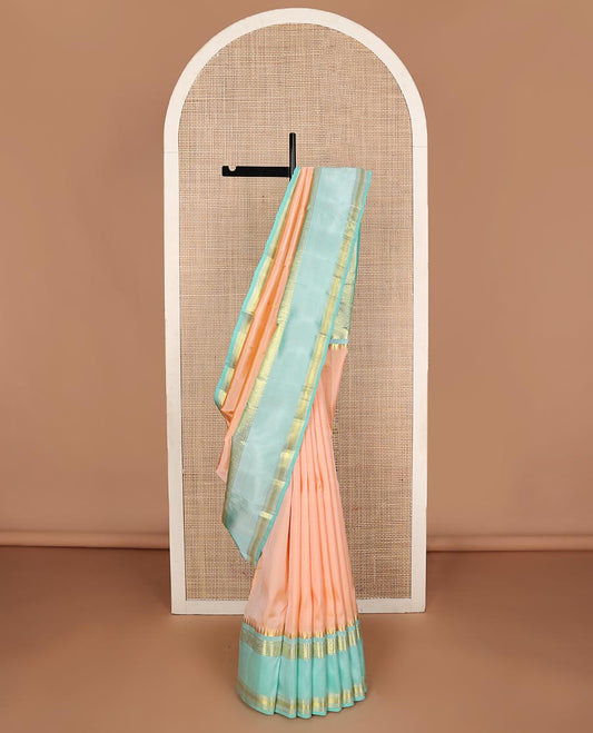 Light orange zari buttas Kanchipuram silk saree, contrast thazampoo rekku border of thilakam mokku,banaras,diamond, and kodi visiry designs and jaal pallu