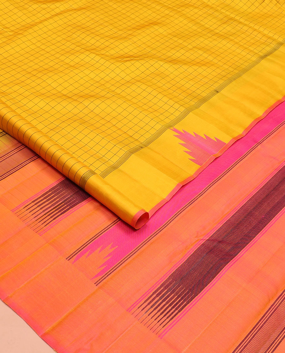 Yellow checked Kanchipuram silk saree, thazampoo rekku border, and pallu of pillaiyar mokku, and seppu rekku designs