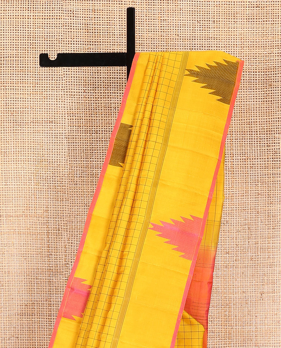 Yellow checked Kanchipuram silk saree, thazampoo rekku border, and pallu of pillaiyar mokku, and seppu rekku designs
