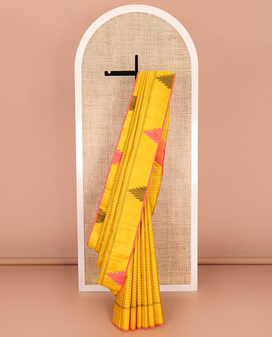 Yellow checked Kanchipuram silk saree, thazampoo rekku border, and pallu of pillaiyar mokku, and seppu rekku designs