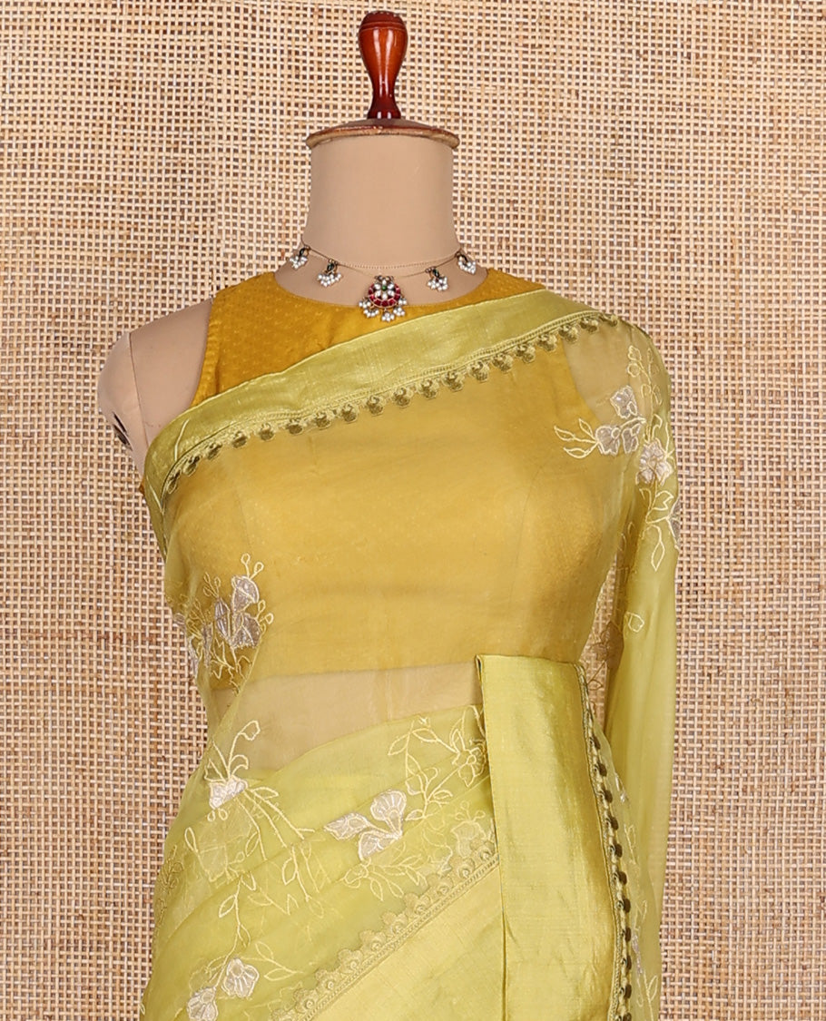 Green floral vine embroidered organza designer saree, satin embroidered border