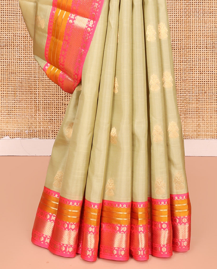 Green Vasundhara Lite Silk Mix Saree, Sparsely Woven with Iruthalai Pakshi Buttas All Over Its Body, Complemented by Contrast Border of Salngai, Banaras, Kamalam, and Mayil Kann Designs, Grand Jaal Pallu and Paired with a Contrast Blouse