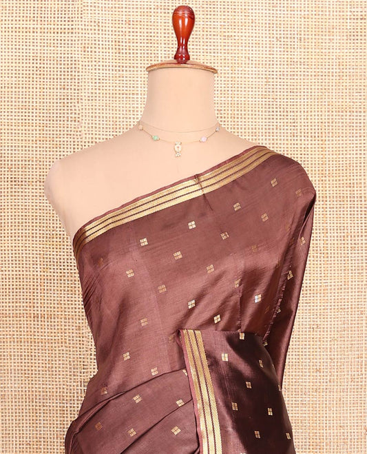 Brown Banana Pith Saree Mesmerized with Square-Shaped Zari Buttas, Subtly Woven Zari Piping Border, Pallu Gleamed Up with Zari Stripes, and Paired with a Matching Blouse