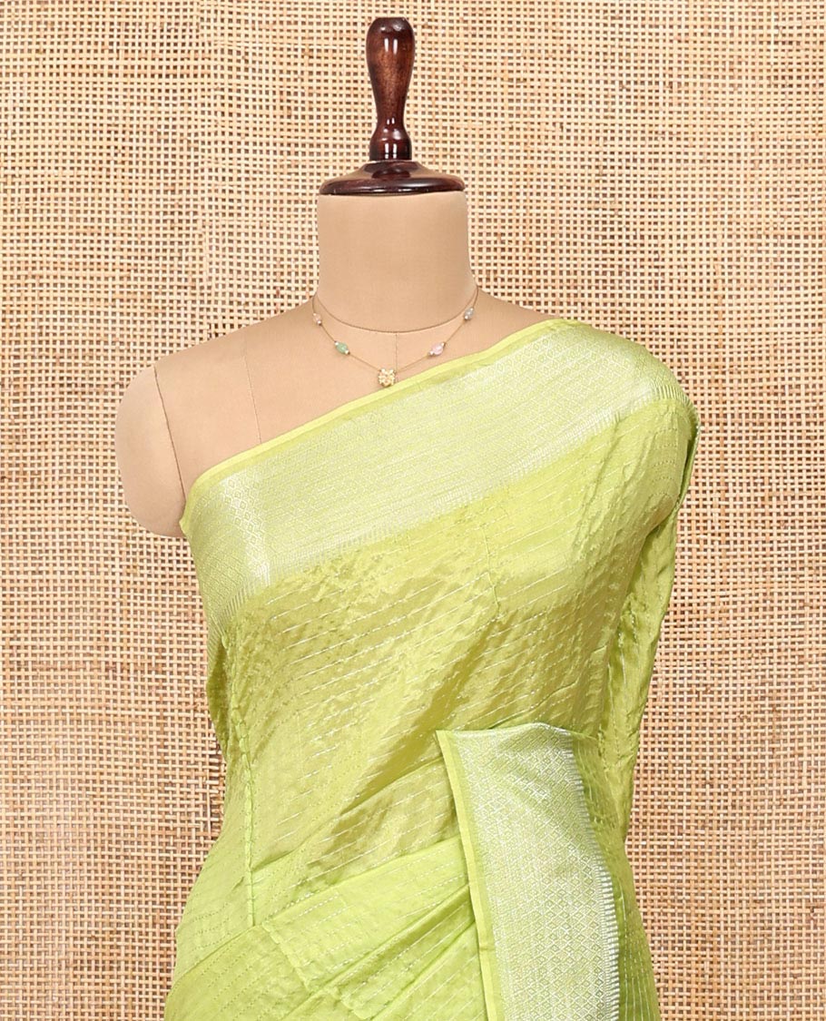 Green Banana Pith Saree, Sparsely Woven with Stripes All Over Its Body, Subtle Self-Border of Jaal Designs, Pallu Steeped with Stripes, and Paired with a Matching Blouse