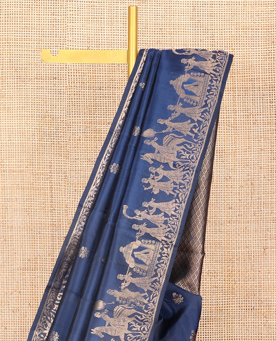 Blue Vasundhara Silk Saree Gleamed Up with Zari Buttas  All Over Its Body, Highlighted by a Zari Border of Wedding-Themed Bridegroom Designs, Pallu Majestically Detailed with Jaal Designs, and Paired with a Matching Blouse