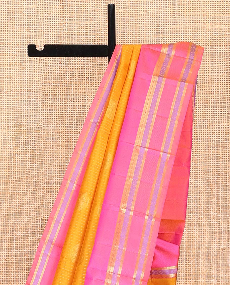 Yellow Vasundhara Silk Saree, Sparsely Woven with Stripes and Chakram Buttas on Its Body, Complemented by a Contrast Border of Rekku, Bentex, and Kodi Visiry Designs, Grand Jaal Design Pallu, and Paired with a Contrast Blouse