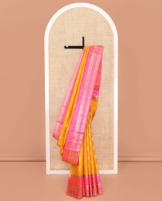 Yellow Vasundhara Silk Saree, Sparsely Woven with Stripes and Chakram Buttas on Its Body, Complemented by a Contrast Border of Rekku, Bentex, and Kodi Visiry Designs, Grand Jaal Design Pallu, and Paired with a Contrast Blouse