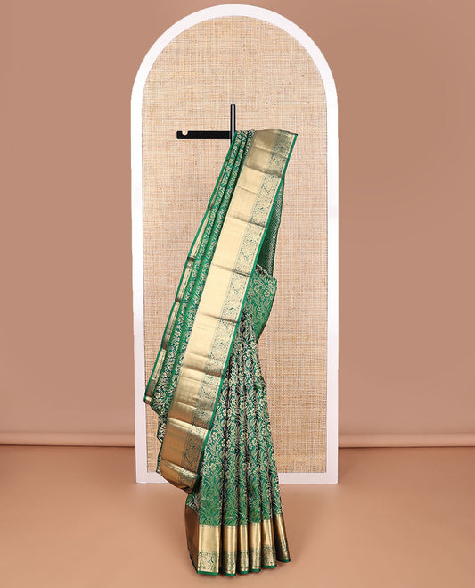 Green floral jacquard kancheepuram silk saree with self border of rekku, paun, banaras design floral pallu