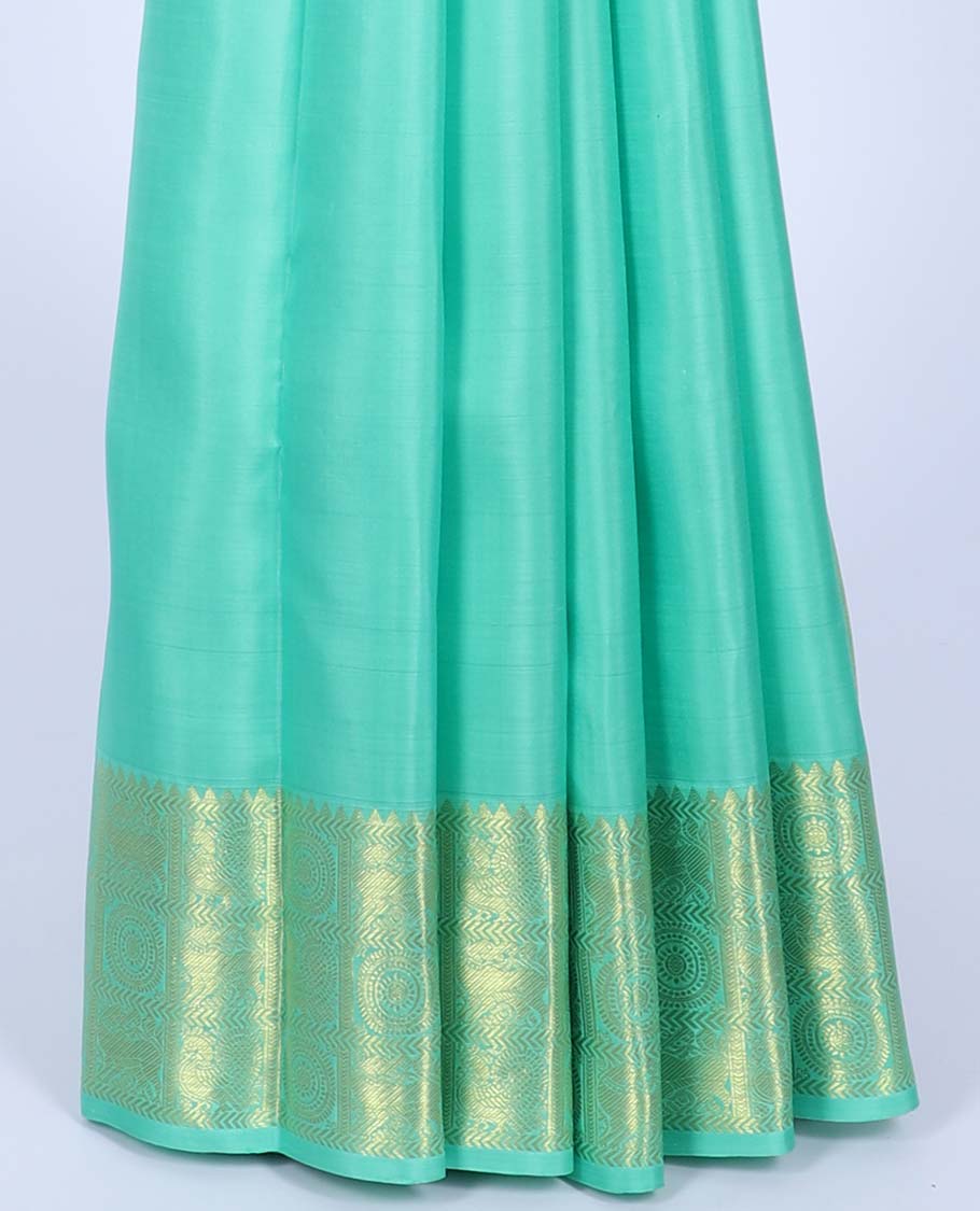 Green kancheepuram koorai silk saree with zari buttas, zari border of rekku,kathir,mayil chakram & yaali & jaal pallu