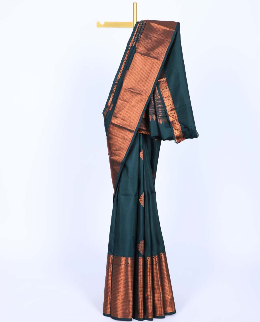 Green buttas kancheepuram koorai silksaree, traditional zari border of thilakam & kodi visiry & pallu of ogee & peacock