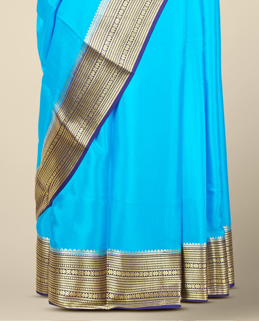 Blue plain design mysore silk saree, contrast zari border steeped with traditional designs & pallu of zari stripes