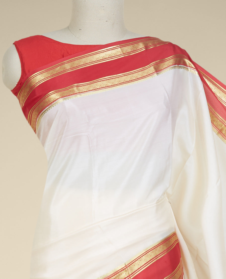 Cream plain design mysore silk saree, contrast traditional zari design border & pallu features zari stripes