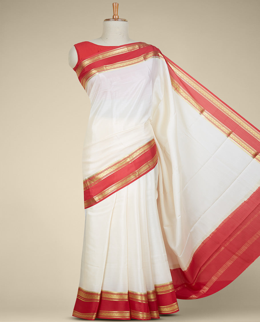 Cream plain design mysore silk saree, contrast traditional zari design border & pallu features zari stripes