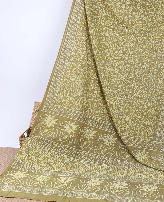 Green batik-printed mul-mul cotton saree with floral vine, self-border & floral batik-printed pallu