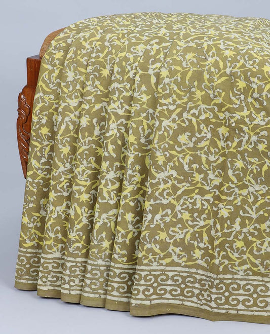 Green batik-printed mul-mul cotton saree with floral vine, self-border & floral batik-printed pallu