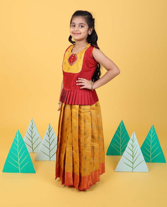 Yellow jacquard readymade art silk pavadai with contrast traditional zari border & sleeveless blouse