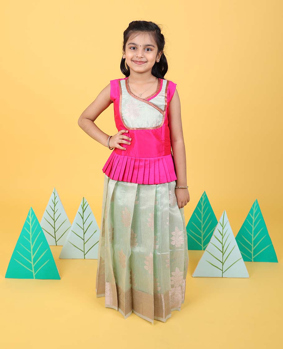 Green floral butta readymade art silk pavadai with traditional zari border & contrast sleeveless blouse