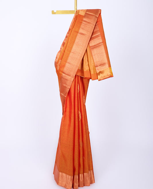 Orange embossed bangalore silk saree with buttas, traditional zari border & pallu of intricate designs
