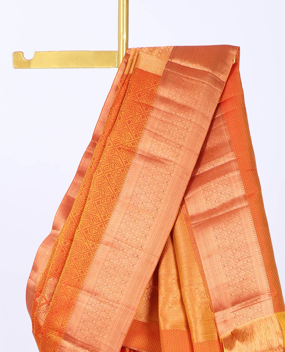 Orange embossed bangalore silk saree with buttas, traditional zari border & pallu of intricate designs