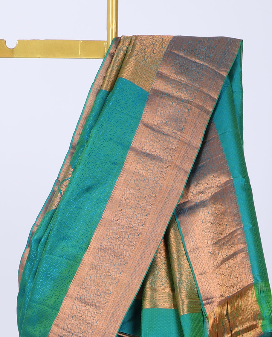 Green embossed Bangalore silk saree with zari buttas, traditional zari border & pallu of intricate designs